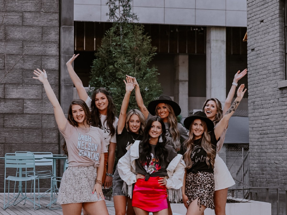 a group of people on a sidewalk