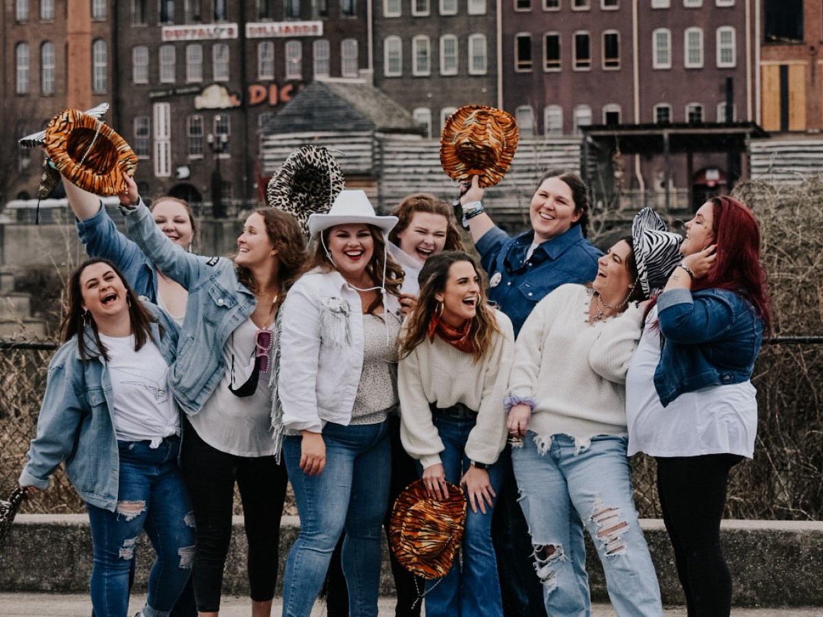 Sarah Robles et al. standing in front of a building