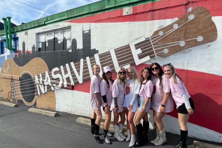 a group of people standing in front of a building
