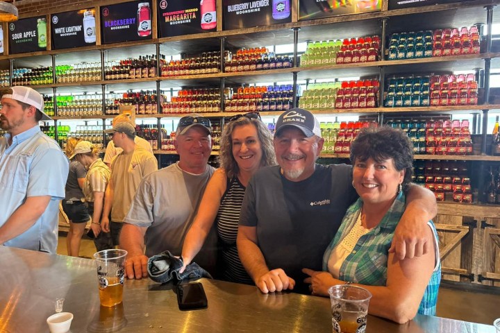 a group of people sitting at a table in a restaurant